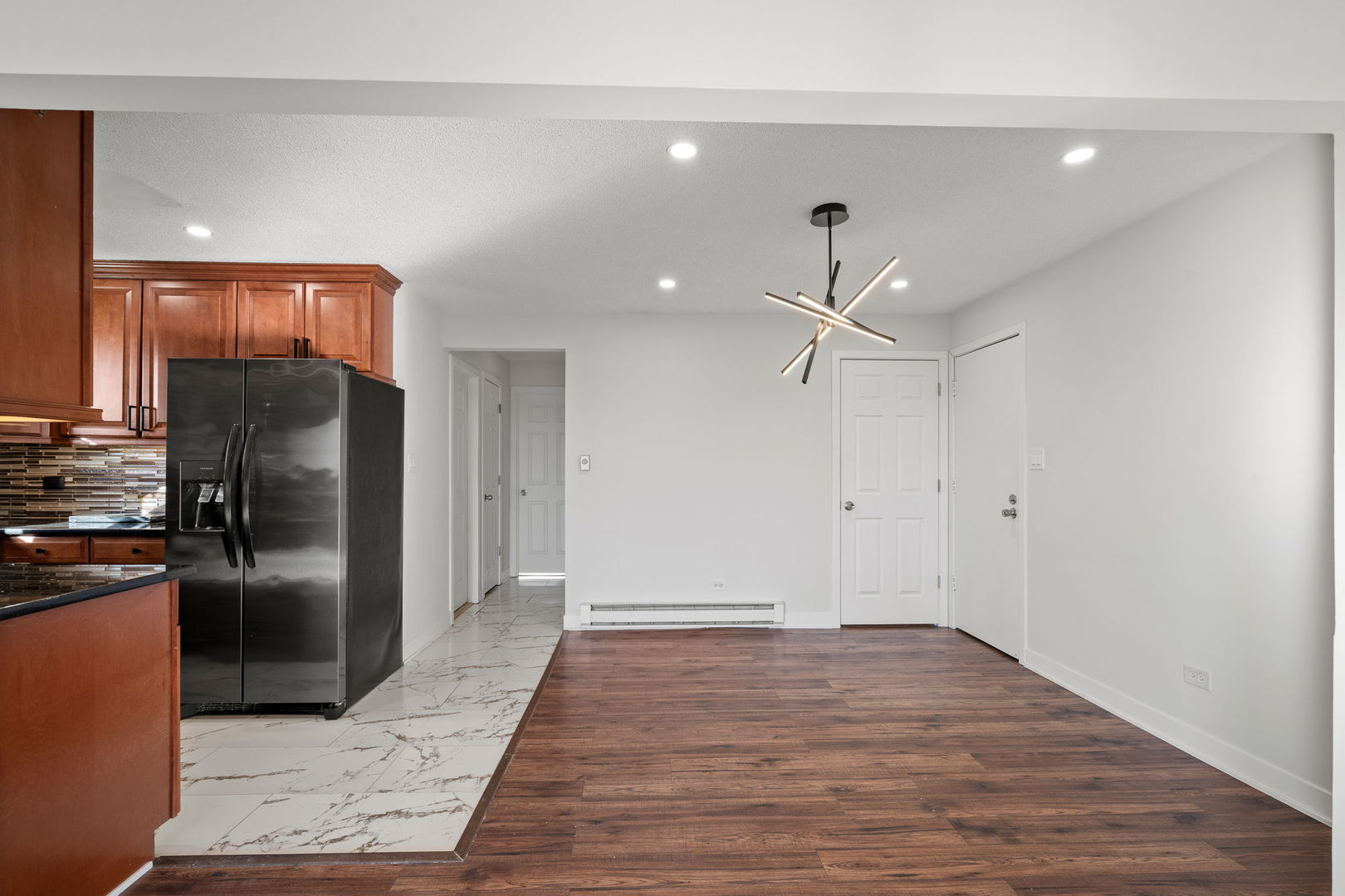 7242 West 86th Street, Unit 3A Bridgeview, IL 60455 - Photo 6 of 14 a view of a kitchen with a sink and refrigerator