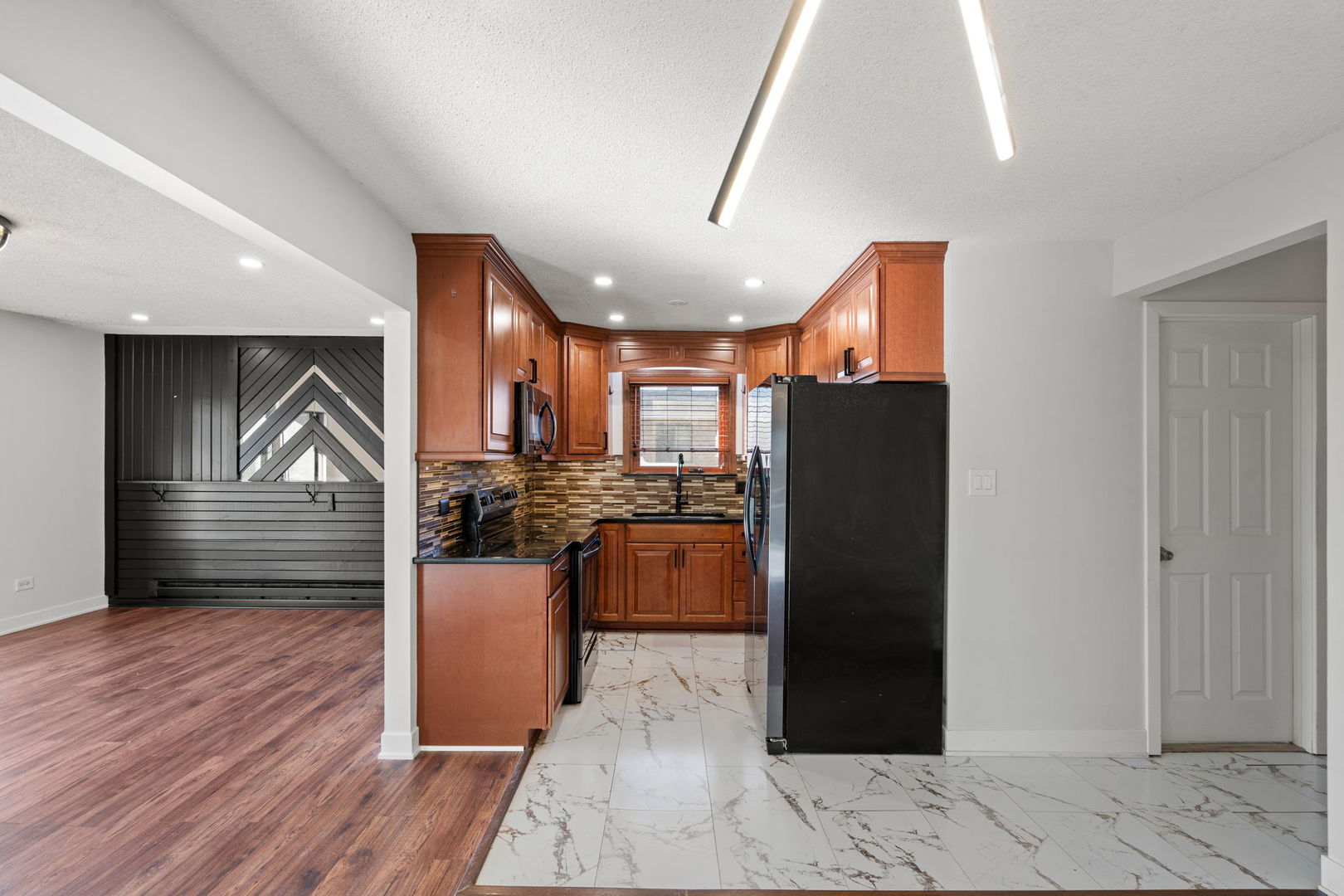 7242 West 86th Street, Unit 3A Bridgeview, IL 60455 - Photo 7 of 14 a kitchen with a refrigerator and a stove