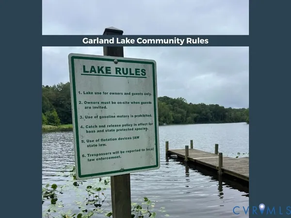 a bathroom with a granite countertop sink a mirror and a bathtub