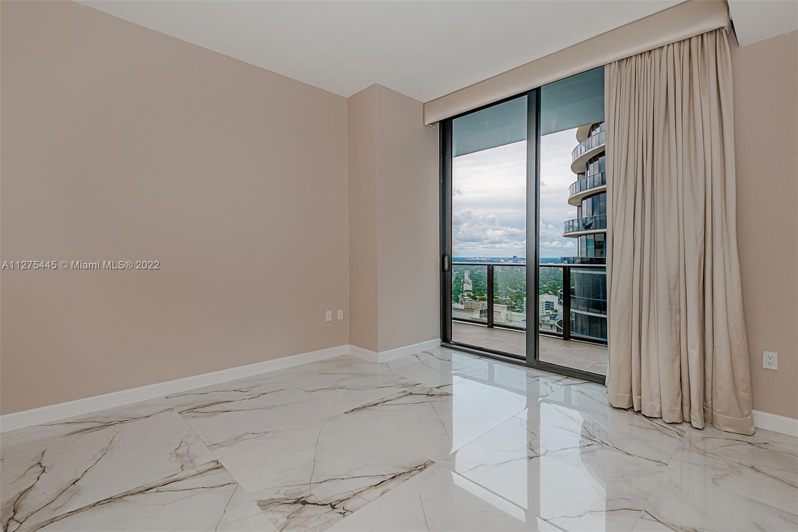 45 Southwest 9th Street, Unit 4206 Miami, FL 33130 - Photo 19 of 19 a view of an empty room with a window
