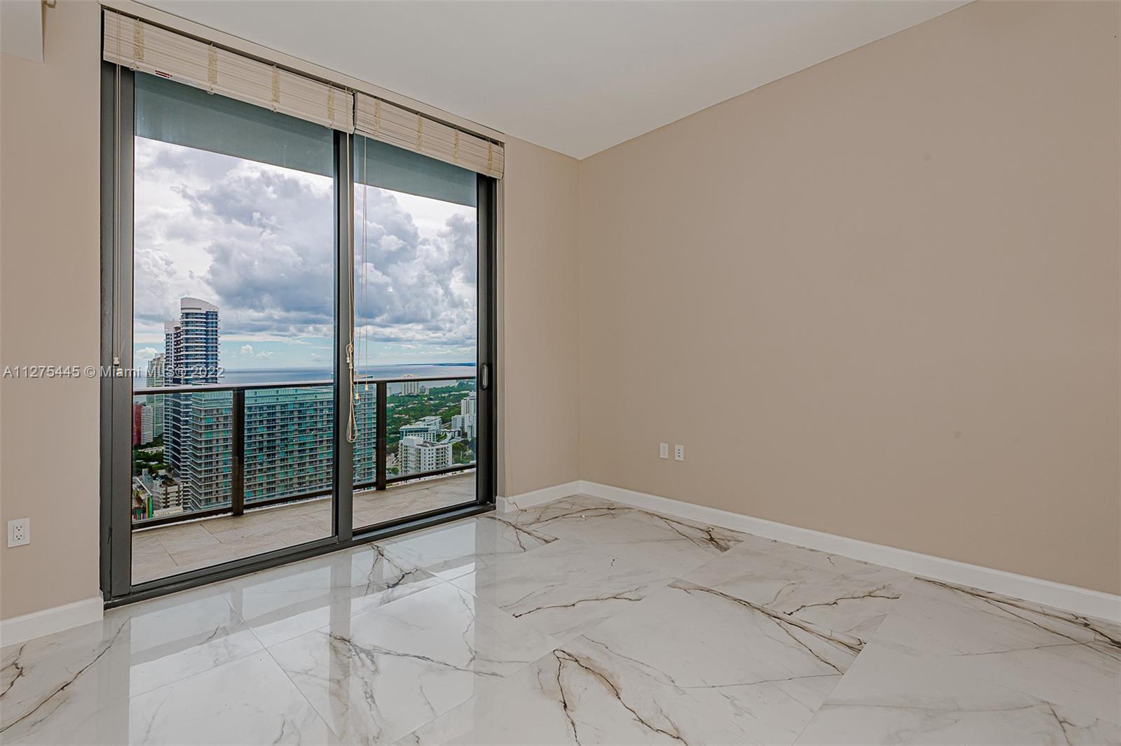 45 Southwest 9th Street, Unit 4206 Miami, FL 33130 - Photo 7 of 19 a view of a room with sliding glass door