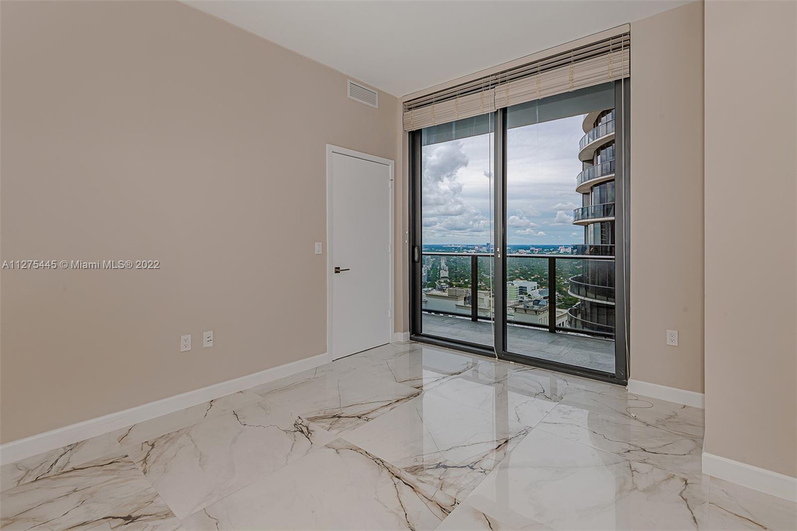 45 Southwest 9th Street, Unit 4206 Miami, FL 33130 - Photo 9 of 19 a view of an empty room and window