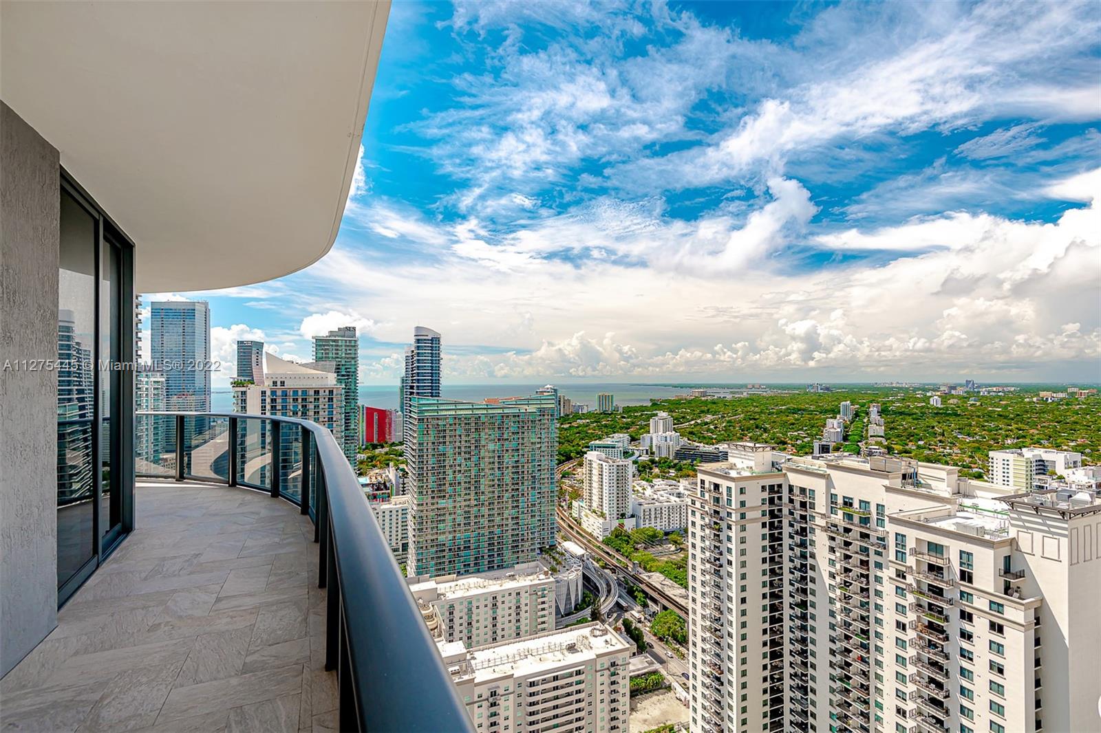 45 Southwest 9th Street, Unit 4206 Miami, FL 33130 - Photo 10 of 19 a view of buildings from a balcony