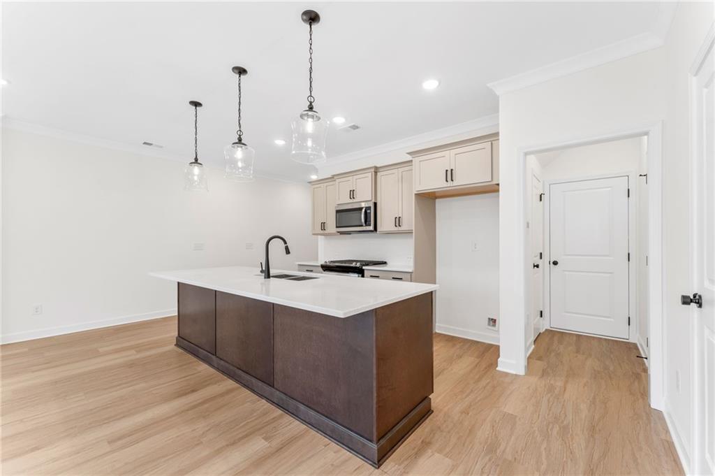 340 Colsen Drive Acworth, GA 30102 - Photo 14 of 25 a kitchen with stainless steel appliances granite countertop a sink stove and wooden floor