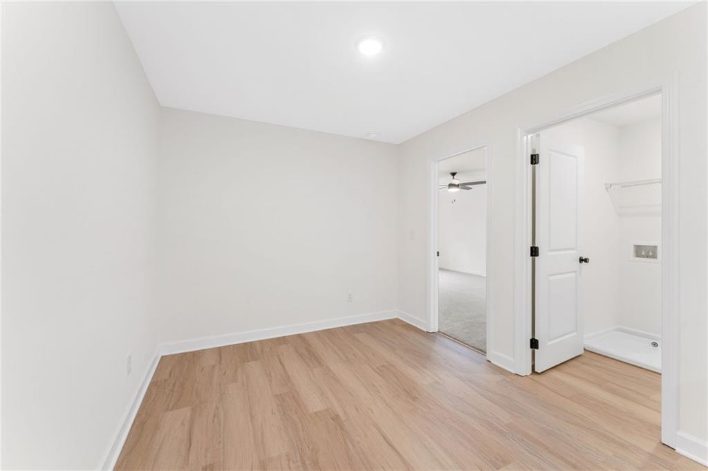 340 Colsen Drive Acworth, GA 30102 - Photo 17 of 25 a view of a room with wooden floor and white doors