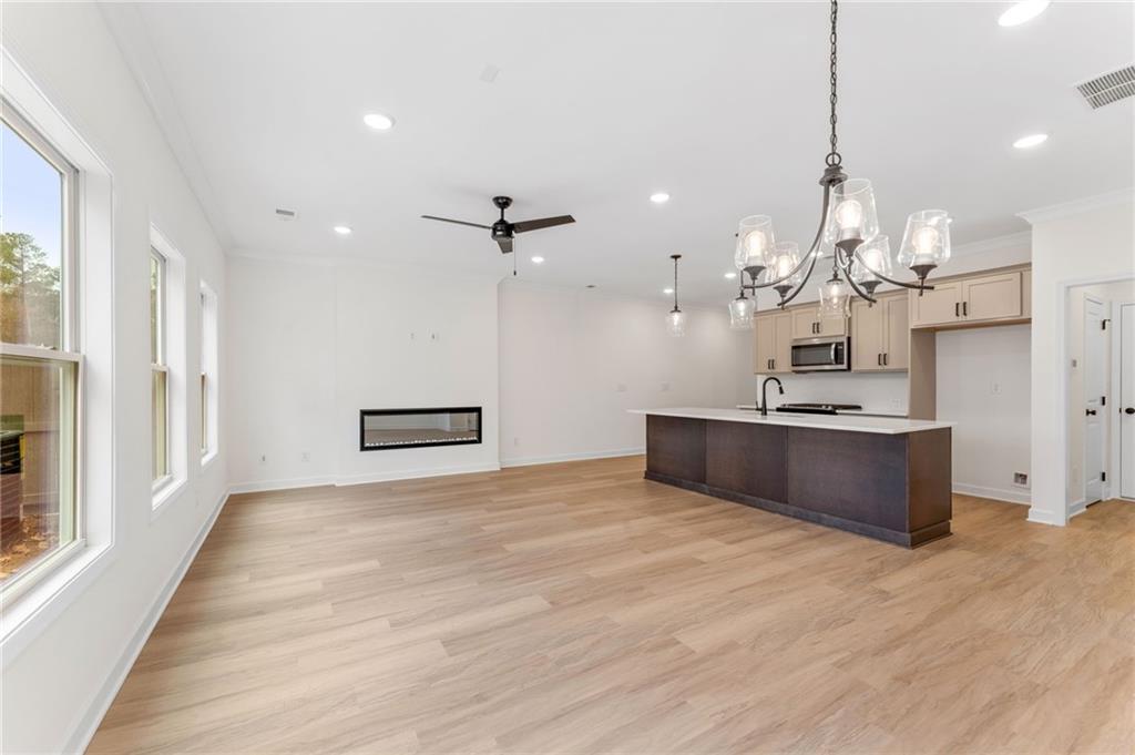 340 Colsen Drive Acworth, GA 30102 - Photo 2 of 25 a view of a kitchen with a sink dishwasher a refrigerator and wooden floor