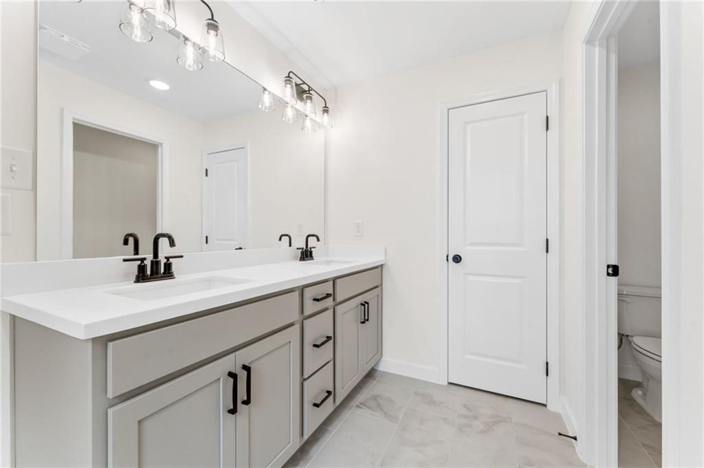340 Colsen Drive Acworth, GA 30102 - Photo 21 of 25 a bathroom with a double vanity sink mirror and