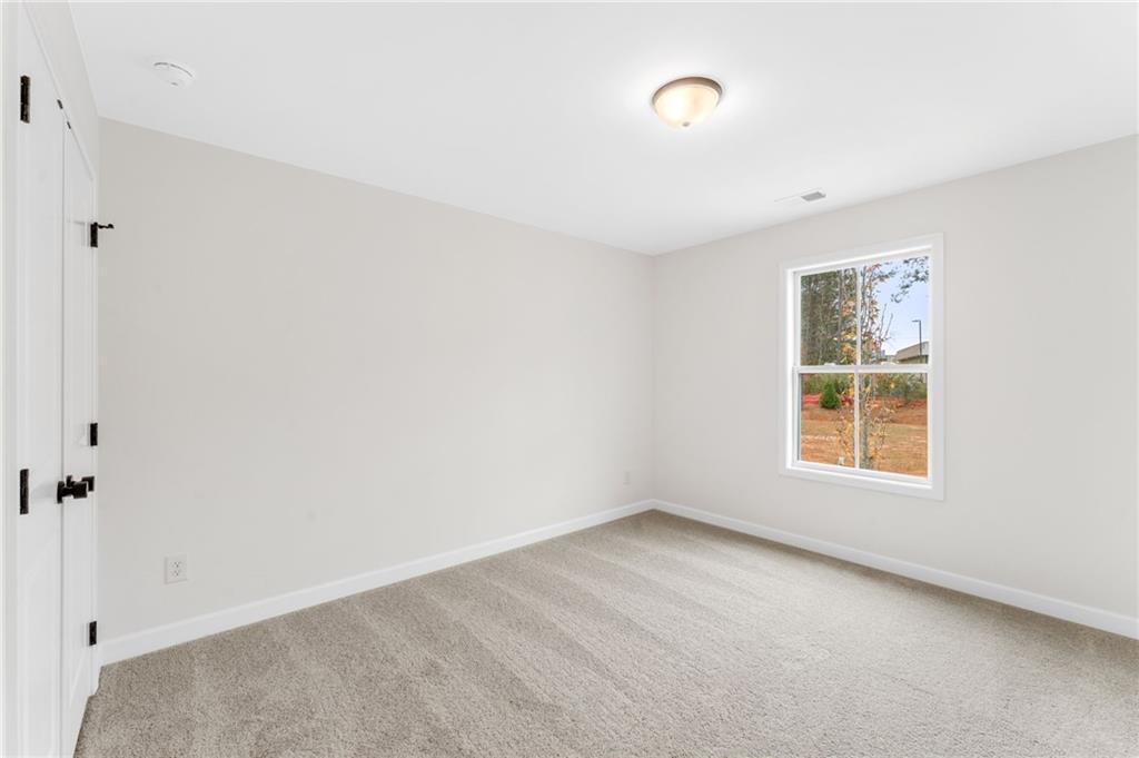 340 Colsen Drive Acworth, GA 30102 - Photo 23 of 25 a view of an empty room with a window