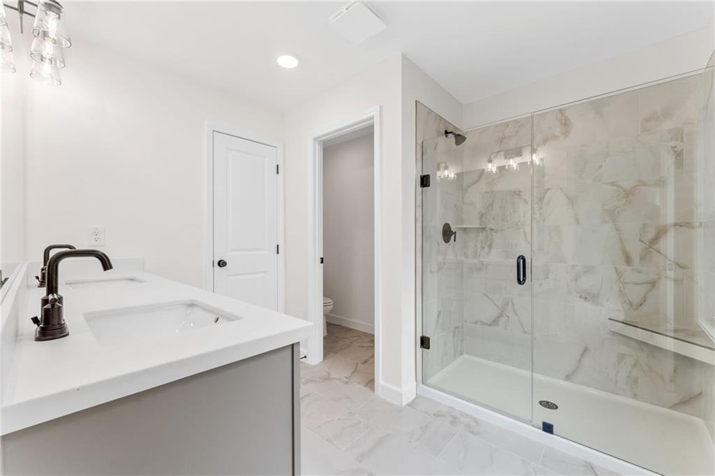 340 Colsen Drive Acworth, GA 30102 - Photo 3 of 25 a bathroom with a sink and a mirror