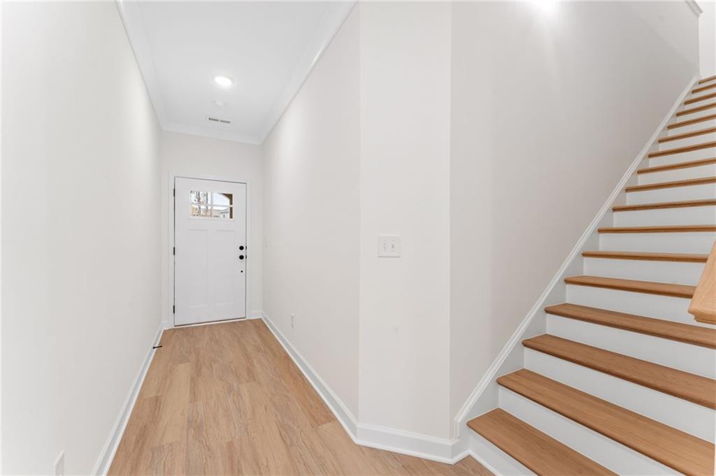 340 Colsen Drive Acworth, GA 30102 - Photo 9 of 25 a view of a hallway with wooden floor and entryway