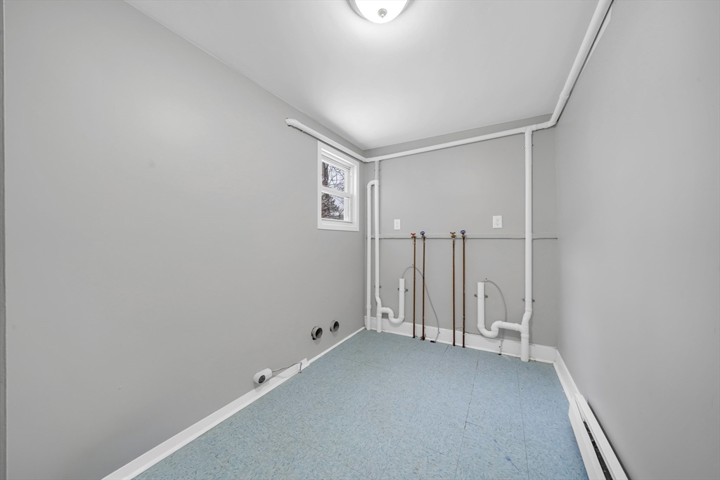 49 6th Street Lowell, MA 01850 - Photo 16 of 37 a view of room with stairs and a window