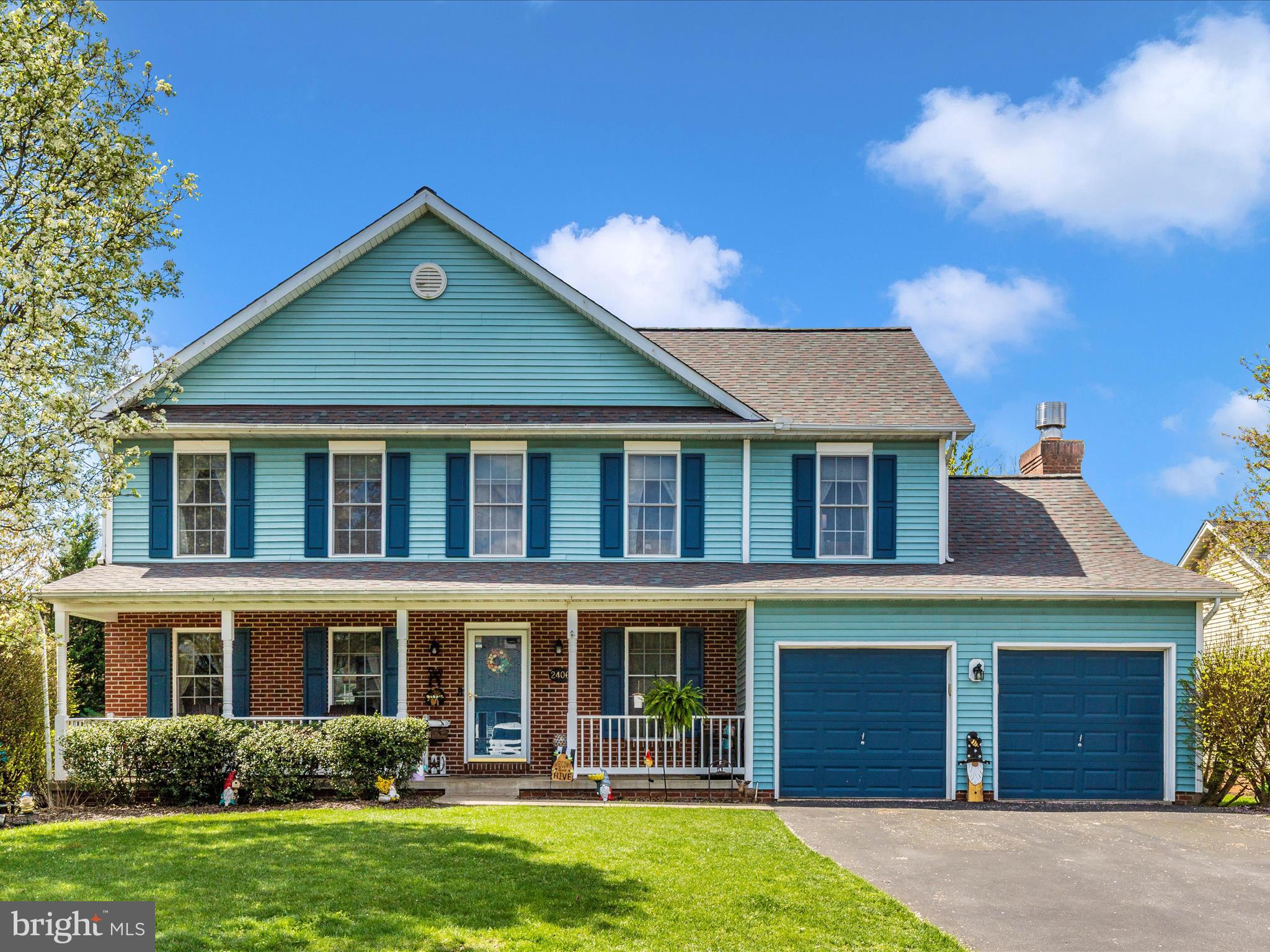 2406 Graystone Lane Frederick, MD 21702 - Photo 1 of 62 a front view of a house with garden