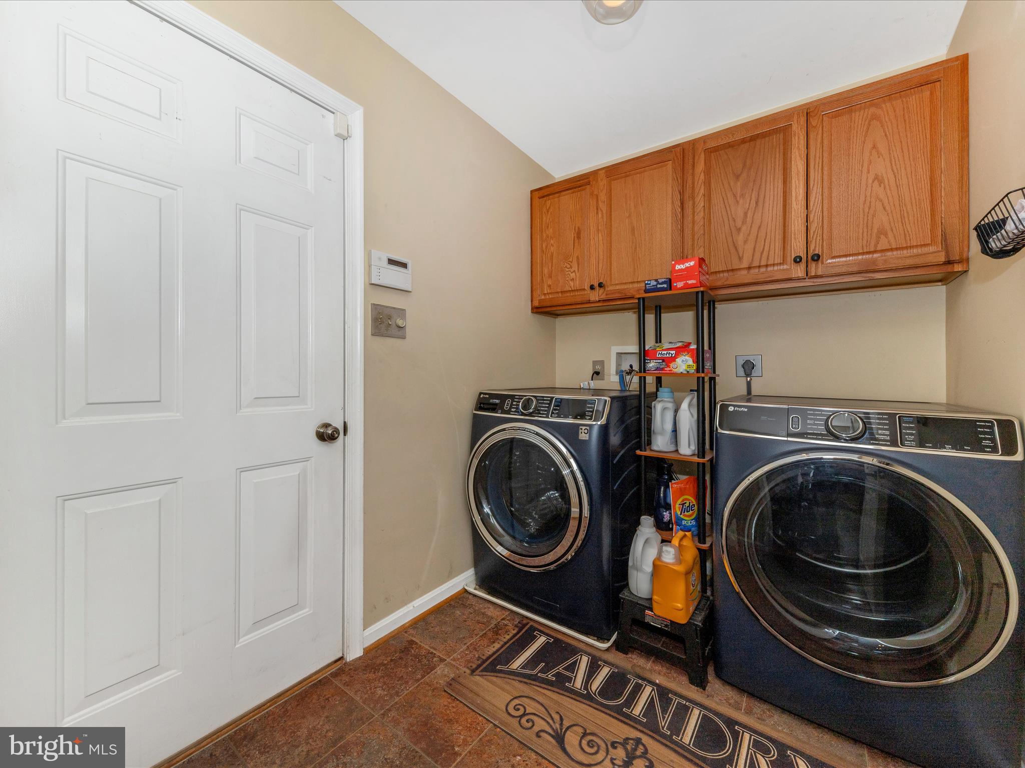 2406 Graystone Lane Frederick, MD 21702 - Photo 20 of 62 a utility room with sink dryer and washer