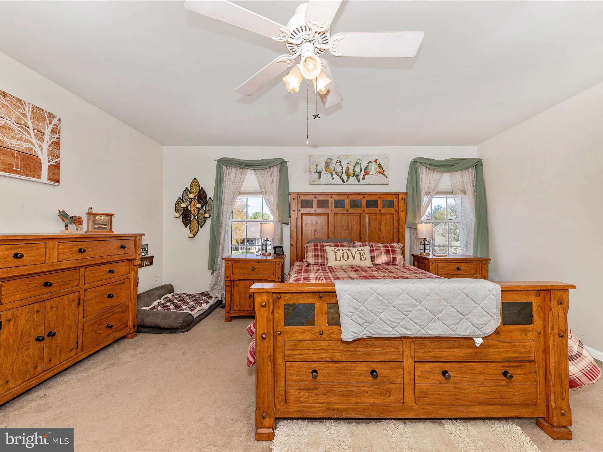 2406 Graystone Lane Frederick, MD 21702 - Photo 22 of 62 a room with a bed and a dresser in it