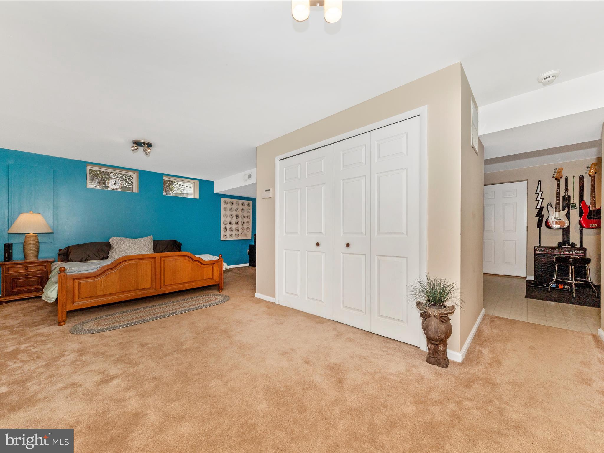 2406 Graystone Lane Frederick, MD 21702 - Photo 33 of 62 a blue bed sitting in a room next to a window