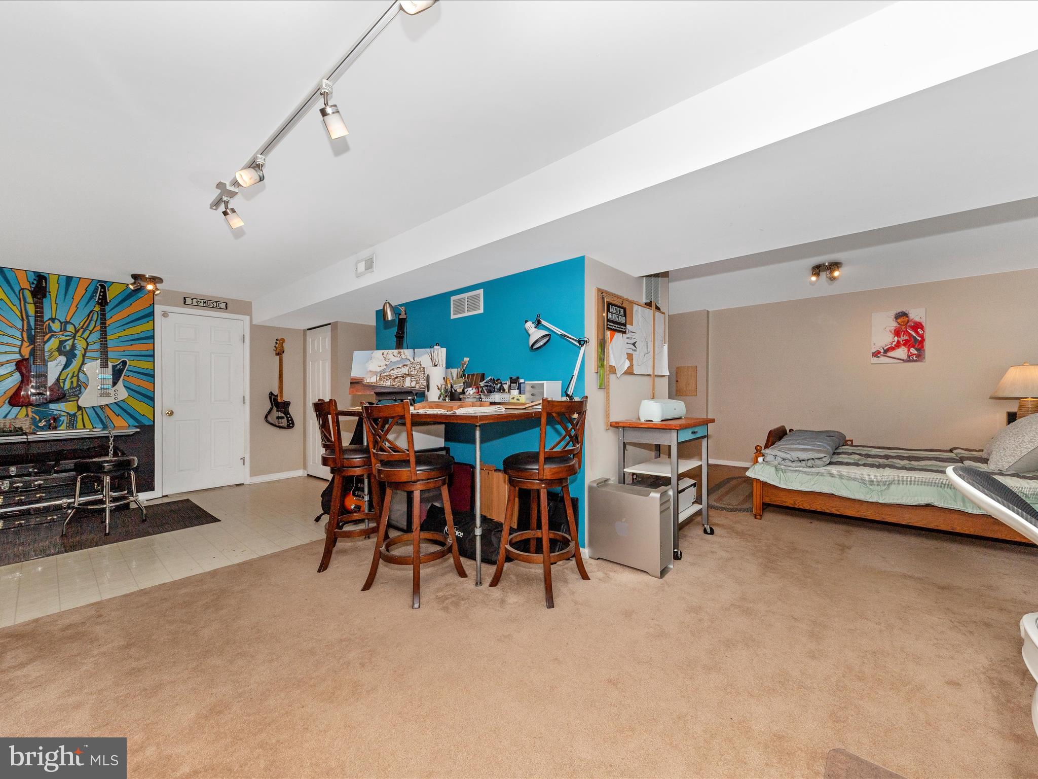 2406 Graystone Lane Frederick, MD 21702 - Photo 34 of 62 a view of a play room with furniture and a flat screen tv