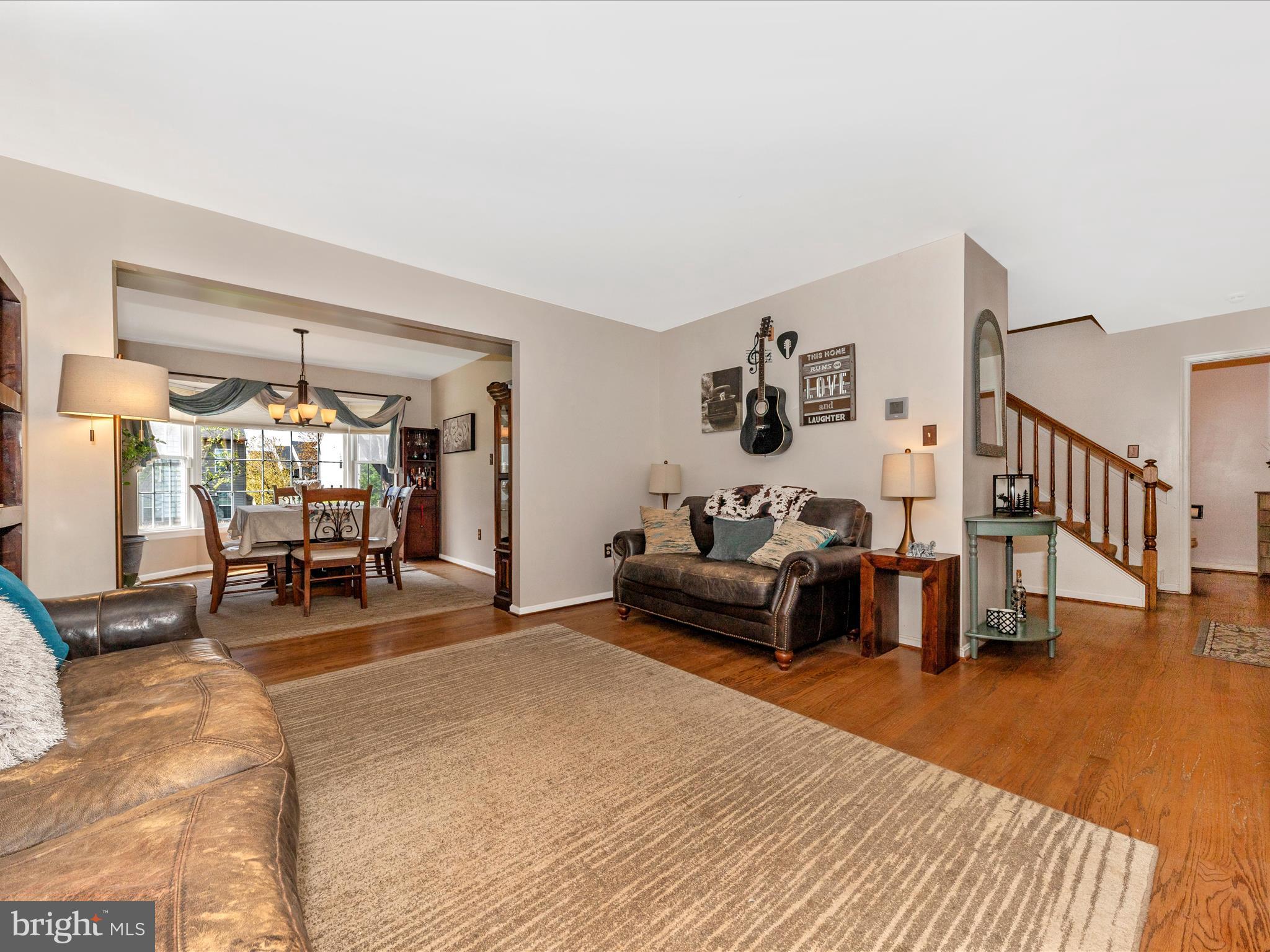2406 Graystone Lane Frederick, MD 21702 - Photo 4 of 62 a living room with furniture and a table