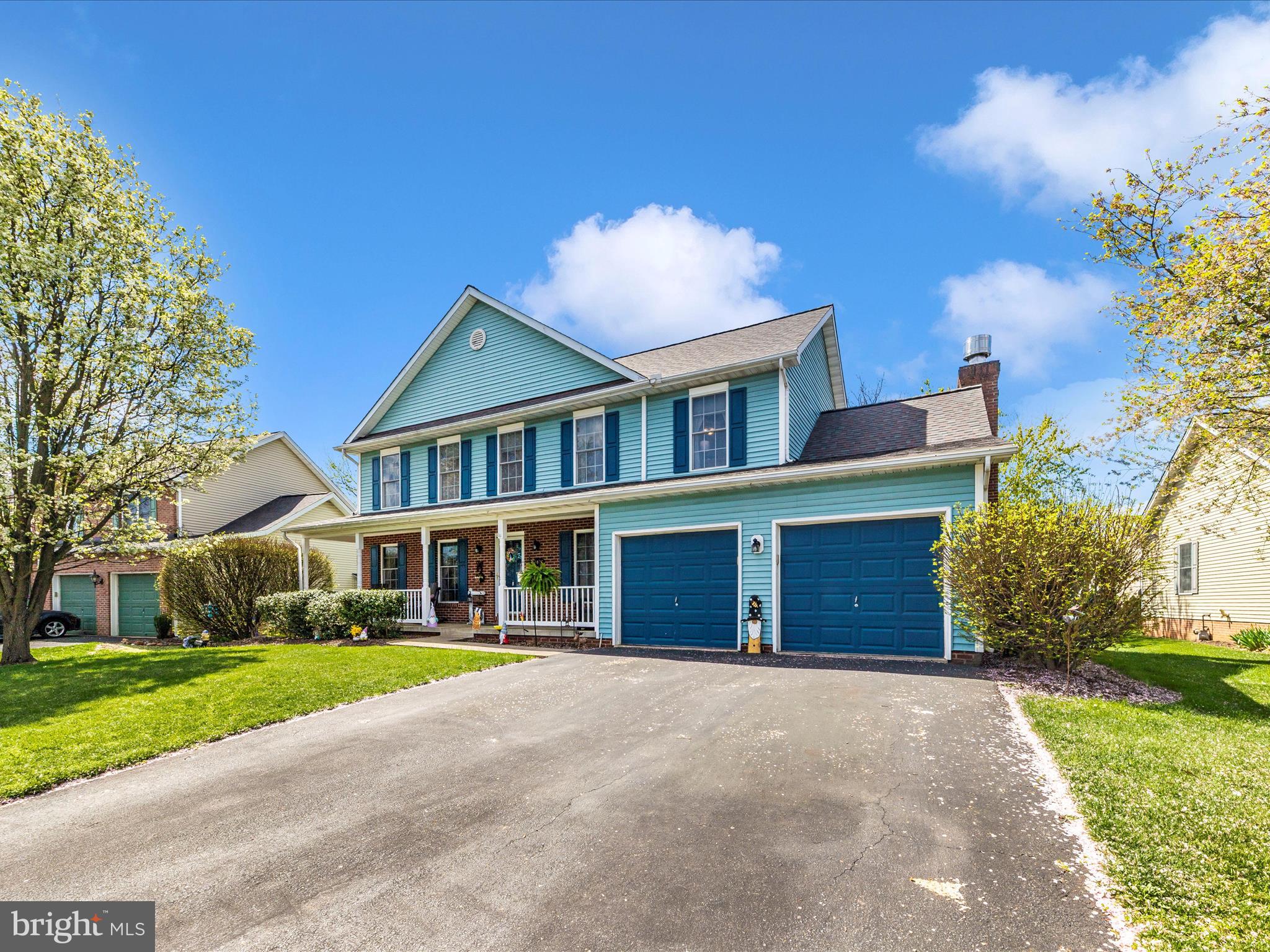 2406 Graystone Lane Frederick, MD 21702 - Photo 41 of 62 a front view of a house with a yard and garage