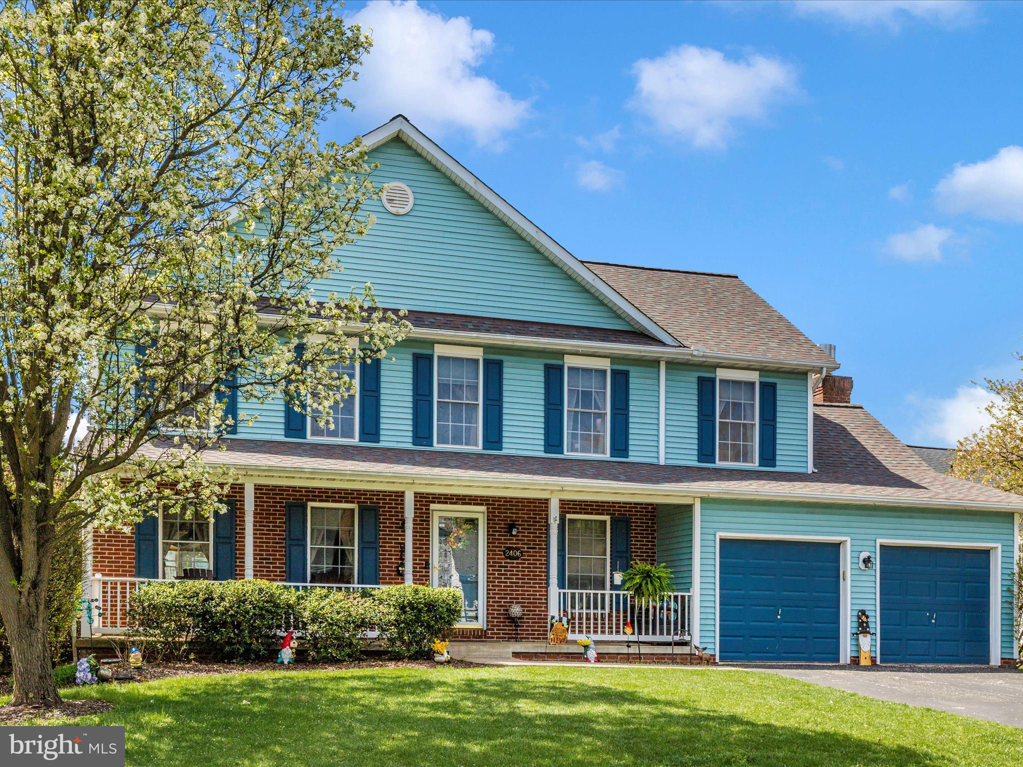 2406 Graystone Lane Frederick, MD 21702 - Photo 42 of 62 a front view of a house with a garden