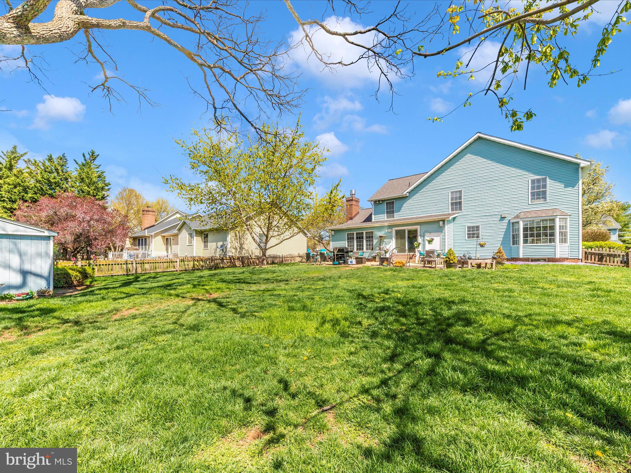 2406 Graystone Lane Frederick, MD 21702 - Photo 48 of 62 a front view of a house with a garden