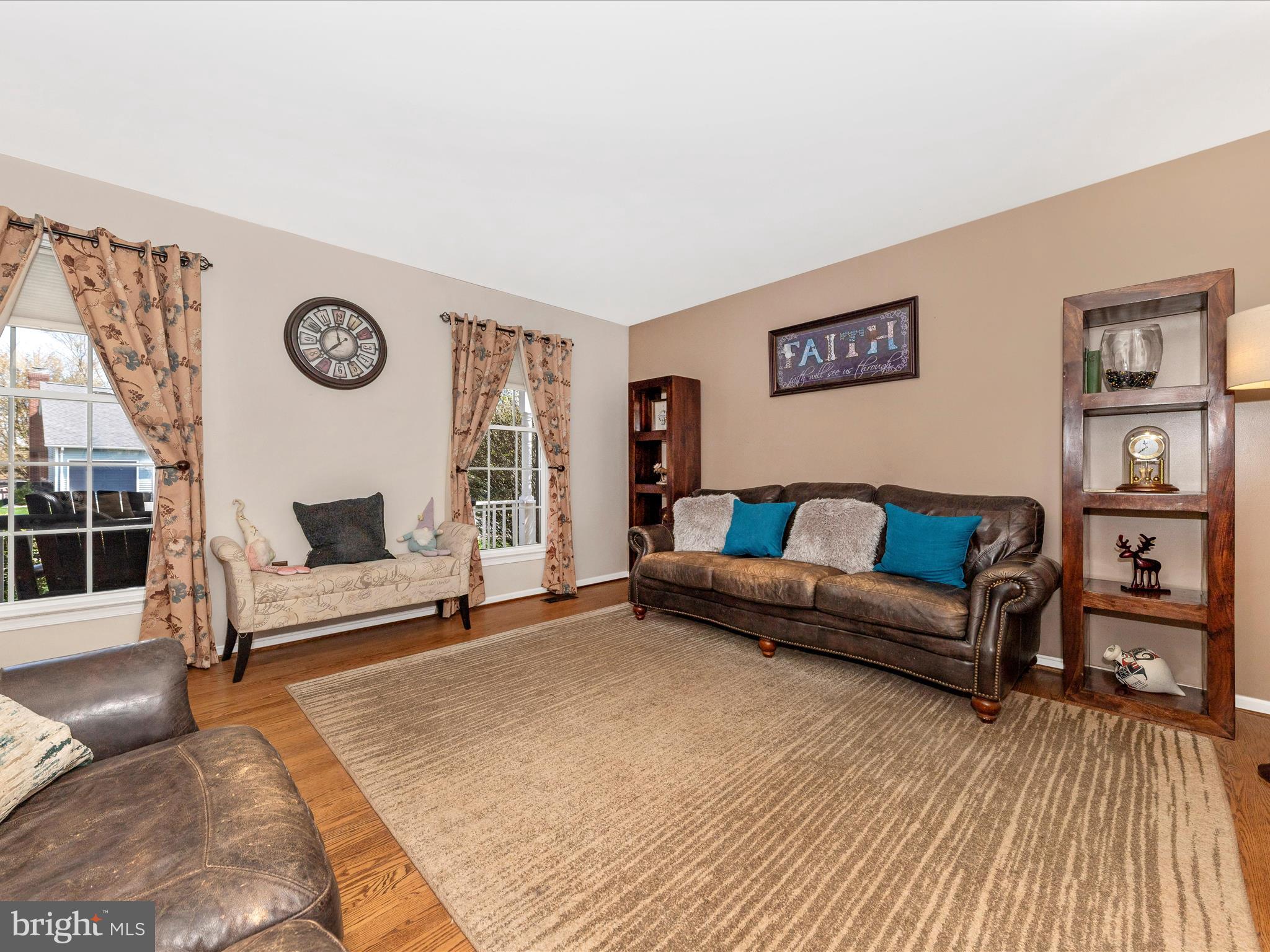 2406 Graystone Lane Frederick, MD 21702 - Photo 5 of 62 a living room with furniture and a wooden floor