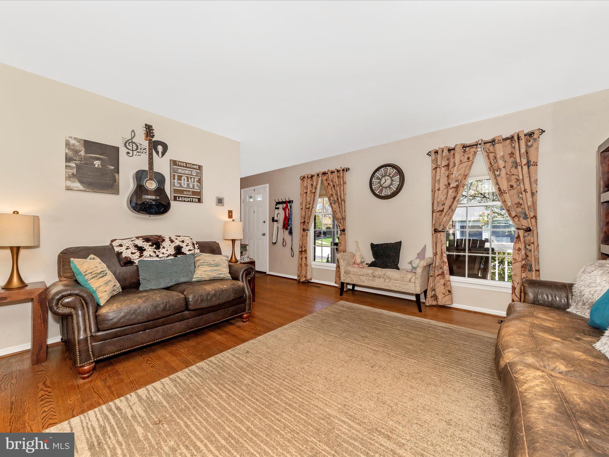 2406 Graystone Lane Frederick, MD 21702 - Photo 6 of 62 a view of a livingroom with furniture and a floor to ceiling window