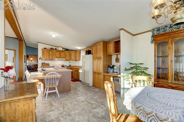 34170 Big Springs Road Yoder, CO 80864 - Photo 10 of 35 Kitchen/Dining Room Combo with New flooring