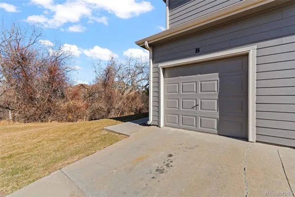 a view of an empty room and a window