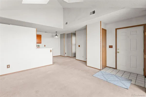 a kitchen with stainless steel appliances a sink and cabinets