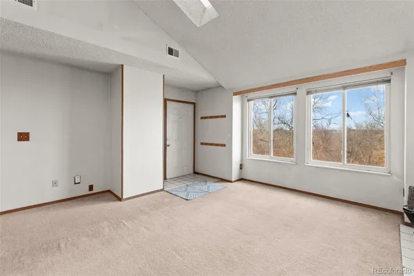 a kitchen that has a sink and a stove
