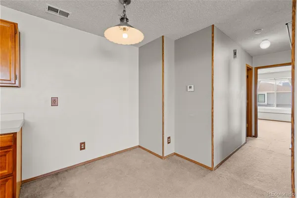 a bathroom with a toilet a sink and a mirror