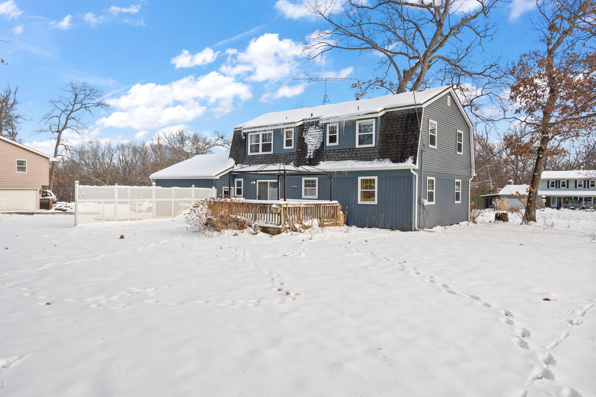 12322 Alexander Street Cedar Lake, IN 46303 - Photo 19 of 21 a front view of a house with a yard covered with snow