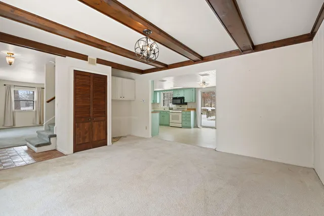 a kitchen with a refrigerator and a sink