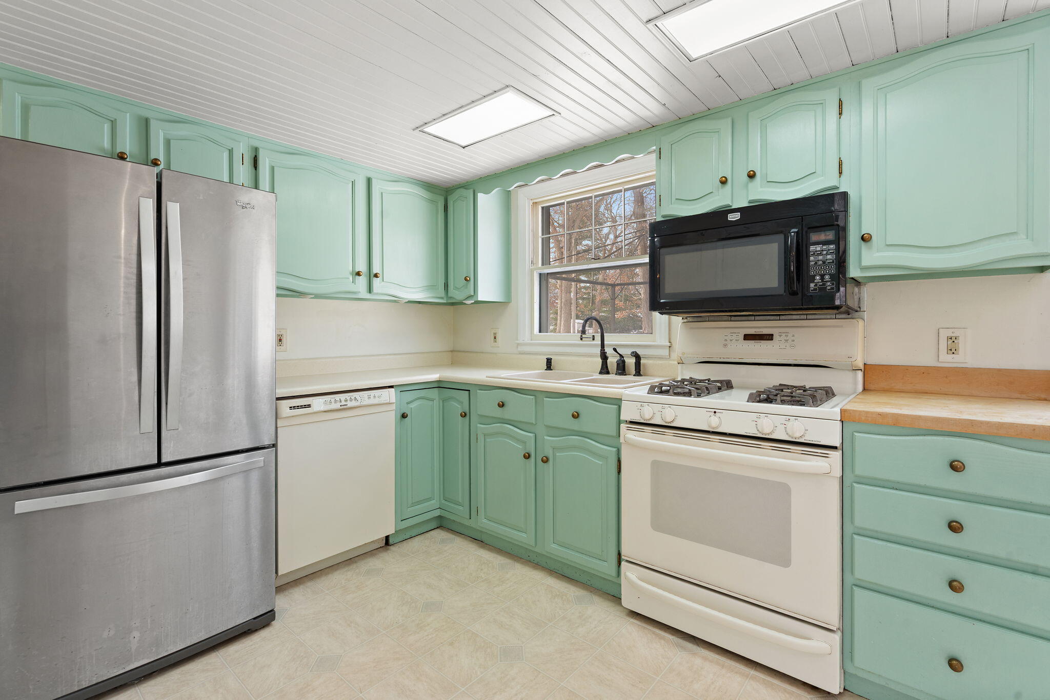12322 Alexander Street Cedar Lake, IN 46303 - Photo 9 of 21 a kitchen with cabinets stainless steel appliances and a window