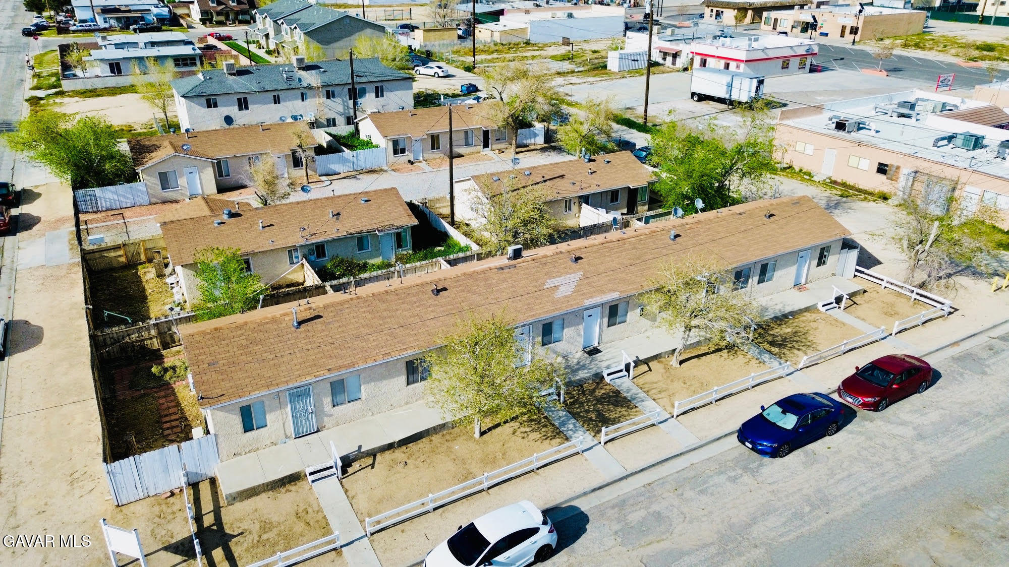 2618 Desert Street, Unit 11 Rosamond, CA 93560 - Photo 8 of 8 an aerial view of residential houses with outdoor space