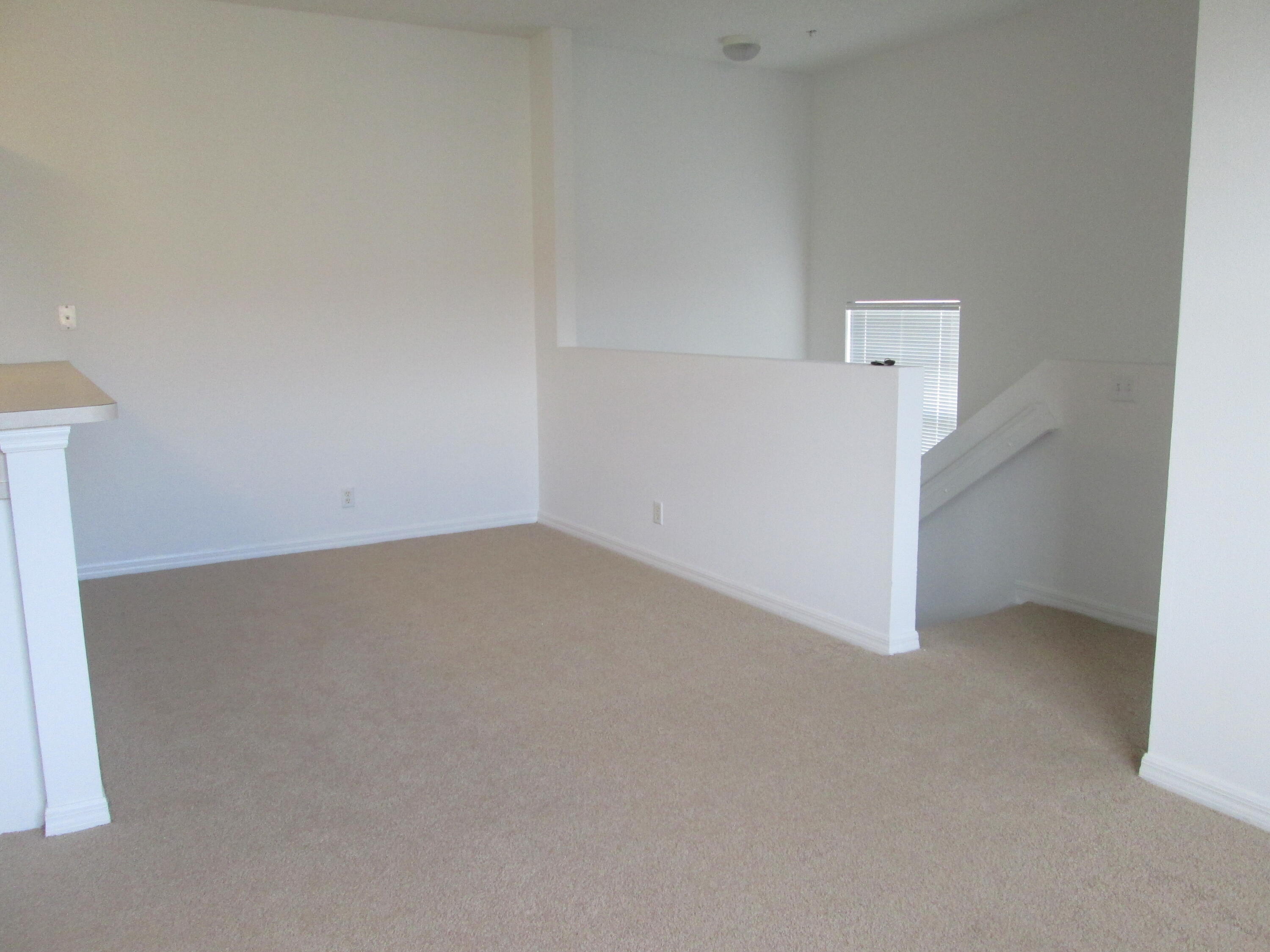 105 Lighthouse Circle, Unit J Tequesta, FL 33469 - Photo 10 of 18 an empty room with a hallway