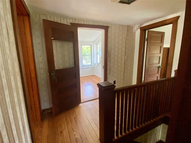 a view of a porch with wooden floor