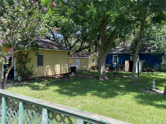 a view of a house with a yard porch and sitting area
