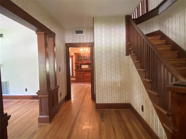 a view of gallery with wooden floor