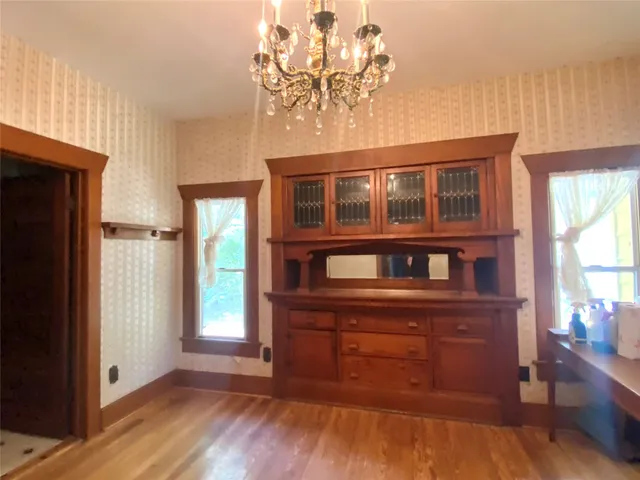 a view of a windows and a chandelier in a room