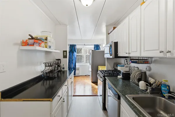 a kitchen with a stove and a microwave