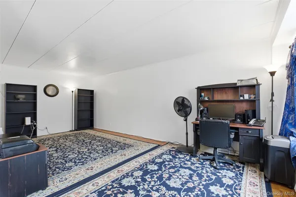 a view of a hallway with a rug