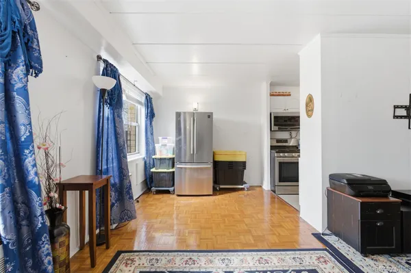 a bedroom with furniture and a window