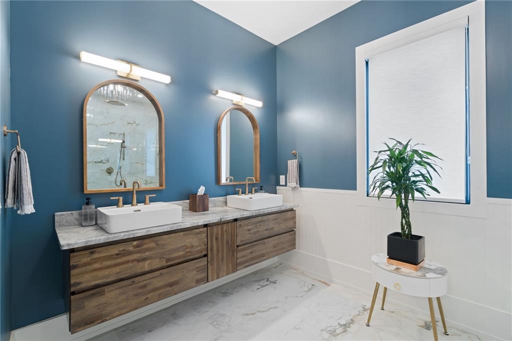 4226 South Berkeley Lake Road Northwest Berkeley Lake, GA 30096 - Photo 11 of 61 a bathroom with a double vanity sink and a mirror
