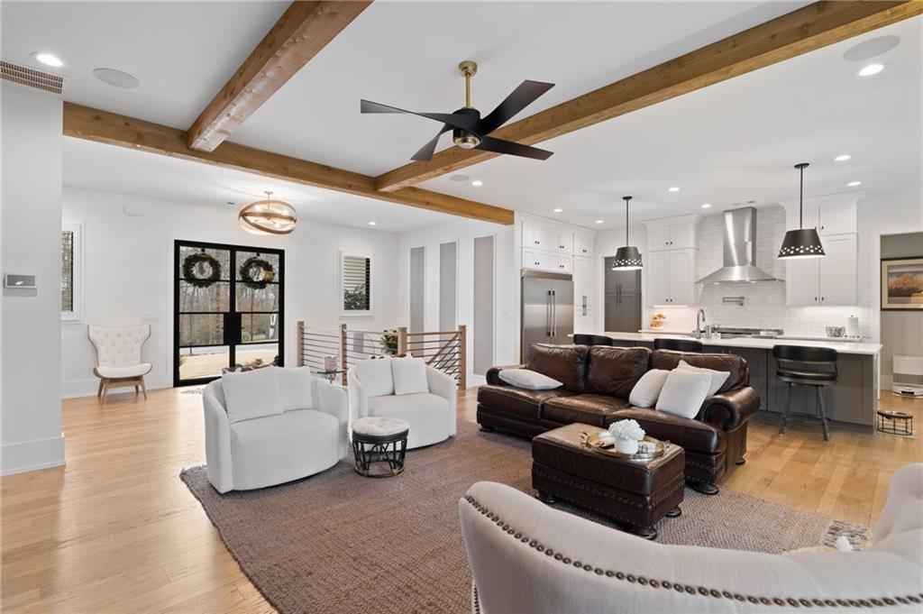 4226 South Berkeley Lake Road Northwest Berkeley Lake, GA 30096 - Photo 15 of 61 a living room with furniture and kitchen view