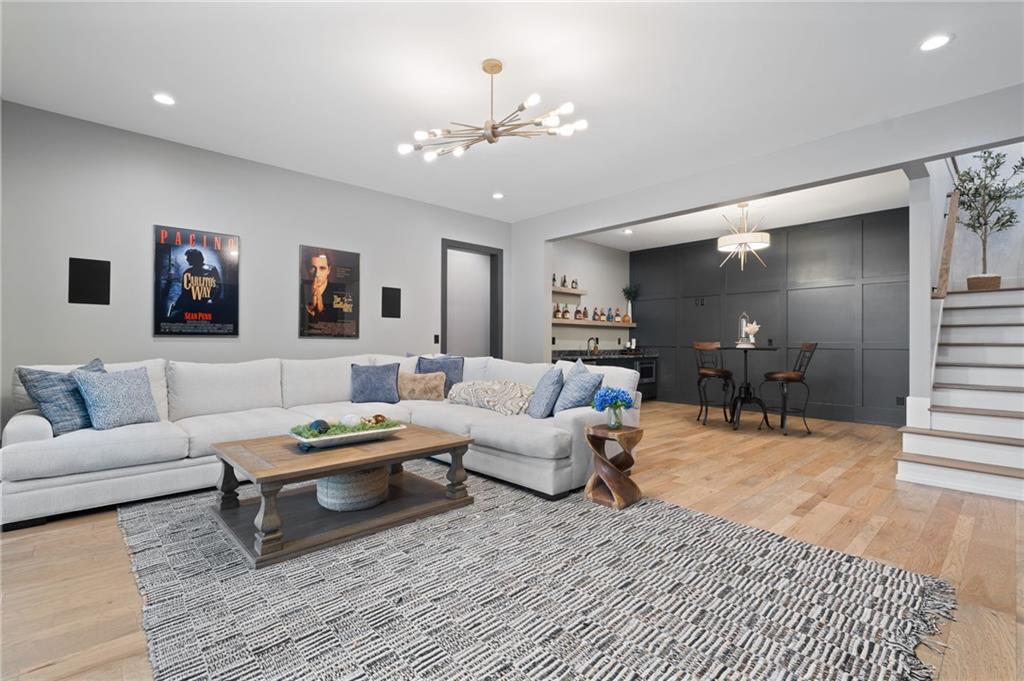 4226 South Berkeley Lake Road Northwest Berkeley Lake, GA 30096 - Photo 27 of 61 a living room with furniture and wooden floor