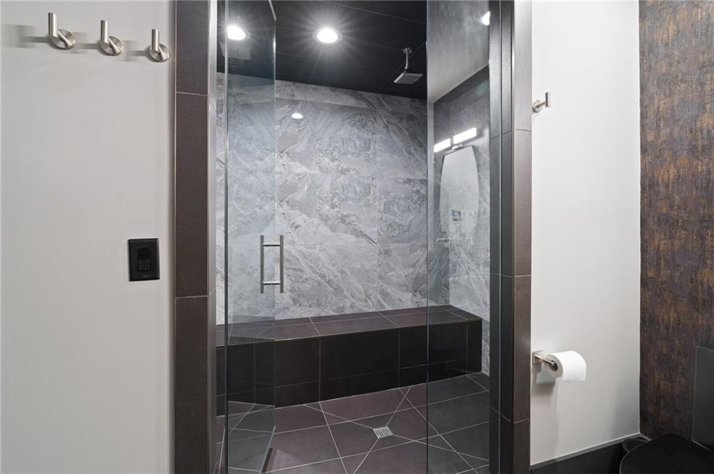 4226 South Berkeley Lake Road Northwest Berkeley Lake, GA 30096 - Photo 34 of 61 a bathroom with a bathtub and shower