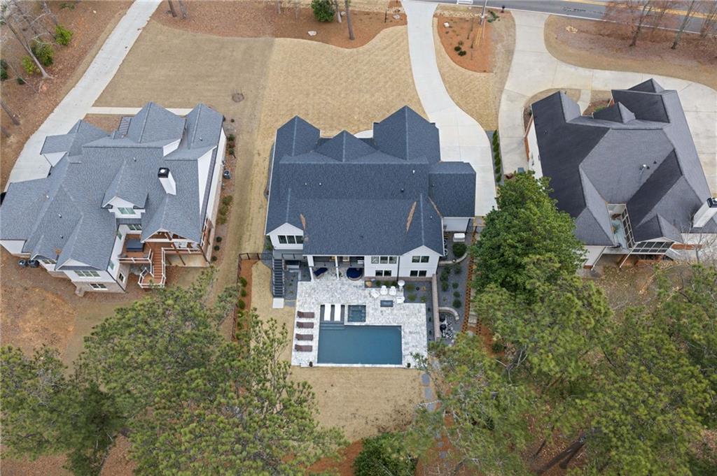 4226 South Berkeley Lake Road Northwest Berkeley Lake, GA 30096 - Photo 37 of 61 an aerial view of a house with a yard