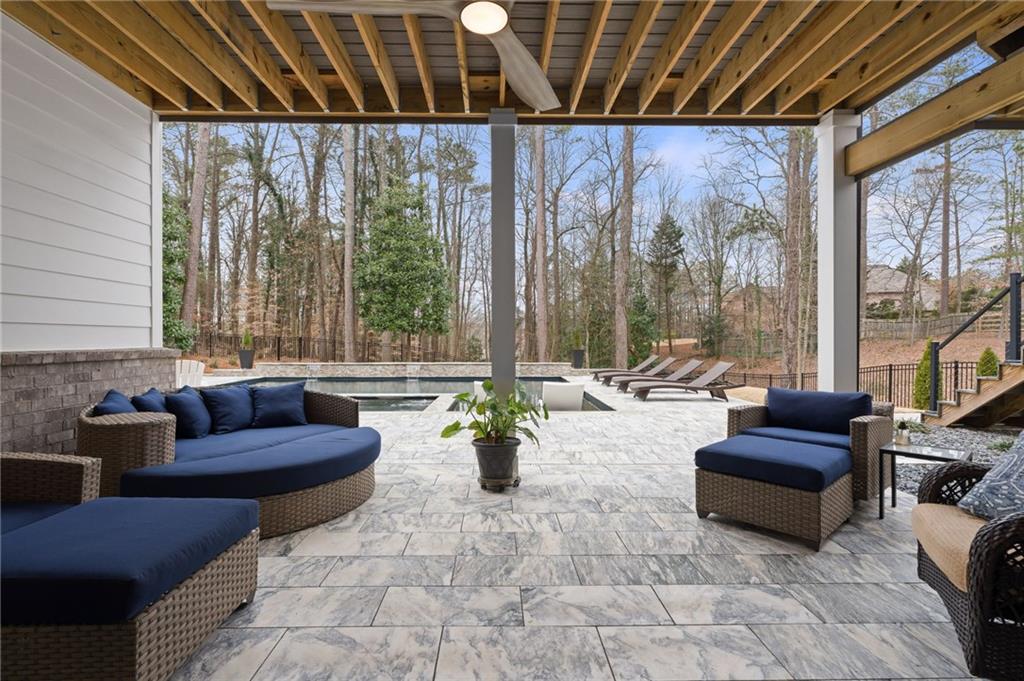 4226 South Berkeley Lake Road Northwest Berkeley Lake, GA 30096 - Photo 40 of 61 a living room with furniture and a large window