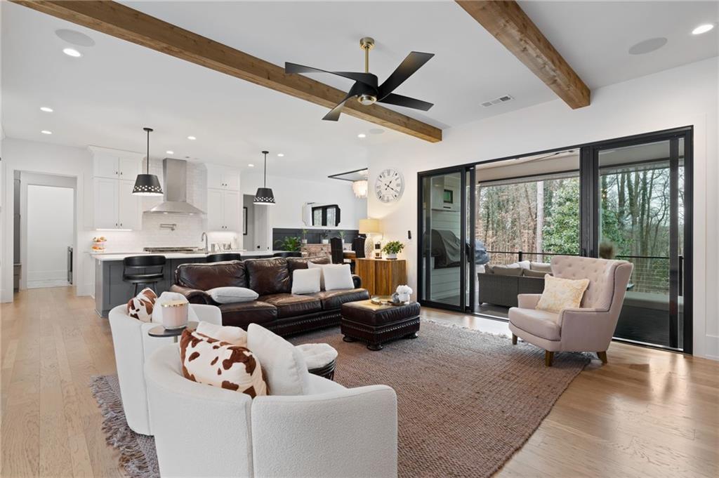 4226 South Berkeley Lake Road Northwest Berkeley Lake, GA 30096 - Photo 4 of 61 a living room with furniture and a large window
